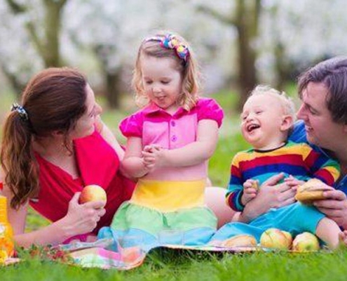Image of a family playing in a garden